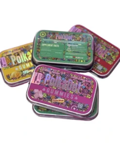 A group of colorful polka dot gummies tins
